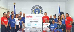 Gov. Eloy S. Inos, seated third from right, attends the launching of Tan Holdings and TSL Foundation's Project Ayudu yesterday at the Governor's Office conference room on Capitol Hill. Representatives of CNMI CARE-member organizations were also present at the launching. (Roselyn B. Monroyo)