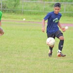 The CNMI U19 National Team’s Ryan Relucio receives a pass from Greg Sablan during their scrimmage against U14 and U16 players yesterday at the Oleai Sports Complex Field. (Roselyn B. Monroyo)