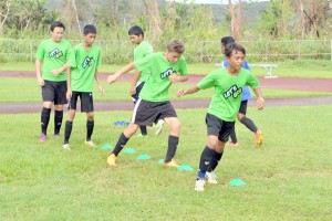 Members of the CNMI U14 National Team perform warm-up drills during a training session at the Oleai Sports Complex Field last month. The squad is now in Beijing, competing in a festival against four other teams. (Roselyn B. Monroyo)