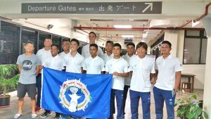 Several members of the CNMI U19 National Team and manager Ruselle Zapanta, right, pose for a photo at the departure area of the Saipan International Airport early yesterday morning before leaving for Thailand. (Contributed Photo)