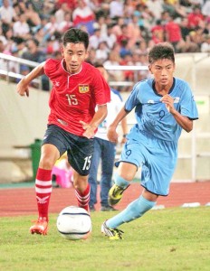 The CNMI’s Mareko Tekopua, right, stays close on defense against Laos’ Thanousone Silipanya during the first half of their game in the AFC U16 Championship India 2016 Qualifiers last Wednesday night at the National Sports Complex Stadium in Vientiane, Laos. (Contributed Photo)