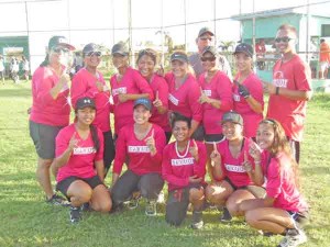 Team Sakudi members and coaching staff celebrate their win after beating the GSM Babes in Game 2 of their finals match in the Belau Women’s Slow-pitch Softball League yesterday at the Dandan Ballfield. (Jon Perez)