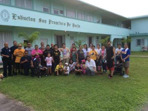 Eskuelan San Francisco De Borja faculty, staff, students, parents, and friends pose with Rota Department of Public Safety personnel after the school’s 2K Walk-A-Thon fundraiser. (Contributed Photo)