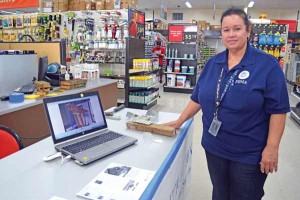 Federal Emergency Management Agency mitigation’s Melva Guzman educates interested residents how to better build or rebuild their homes through the use of hurricane straps at TrueValue in Garapan. (Frauleine S. Villanueva)