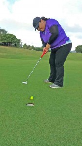 Marianas Golf Association secretary Geri Dela Cruz tries to make a putt during last week’s MGA August Ace of the Month at the Coral Ocean Point Golf Resort. (Contributed Photo)