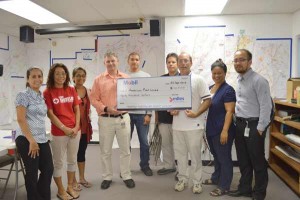 Mobil Oil Mariana Islands, Inc. president Charles Ewart presents Mobil’s $20,000 check donation to the American Red Cross-Northern Mariana Islands Chapter. The donation will be used for short- and long-term recovery efforts, according to ARC. (Frauleine S. Villanueva)