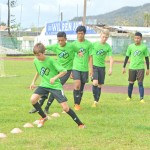 Logan Mister leads a group from the CNMI U14 National Team in doing training drills at the Oleai Sports Complex Field last month. (Roselyn B. Monroyo)