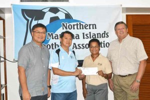 NMIFA general secretary Ross Zapanta, second left, receives Dove and Unilever’s donated check from D&Q Saipan regional sales manager Marilyn Marron, third left, during a brief turnover ceremony at the Fiesta Resort & Spa Saipan yesterdat. Also in the photo are NMIFA president Jerry Tan, left, and D&Q Saipan resident manager Max P. Kretzers, right. (Roselyn B. Monroyo)