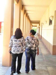 Public School System Education Commissioner Dr. Rita Sablan, left, is accompanied by one staff of Chacha Oceanview Junior High School yesterday morning, as part of her assessment on the first day of schools if all operations were running smoothly. (Jayson Camacho)