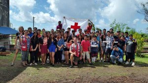 Red Cross Youth volunteers pose with Randy Neeman, center, assistant director for operations; Sue Kohfeldt, right, Client Services; and Mary Ann Taman, NMI Chapter administration. (Contributed Photo)
