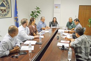 Representatives of Bridge Capital LLC meet with Rep. Joseph “Lee Pan” Guerrero, Saipan Mayor David Apatang, and Saipan Mayor’s Office staff yesterday about the Gov. Froilan C. Tenorio Beach Road Pathway workout stations. (Erwin Encinares)