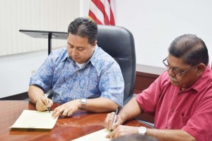 Gov. Ralph DLG Torres, left, and Lt. Gov. Victor B. Hocog sign the proclamation declaring January as Cervical Cancer Awareness Month last week at the conference room of the Office of the Governor. (Jon Perez)