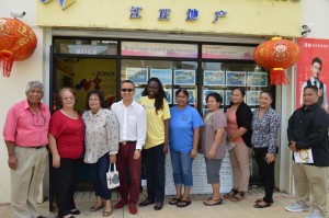 Joint Marketing Inc. president Eric Guo, fourth from left, posing with representatives of the Commonwealth Cancer Association, Empty Vessel, and his staff after donating $5,000 to various community organizations. (Erwin Encinares)