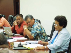 Rep. Felicidad T, Ogumoro, right, delivers her farewell speech on the House floor as Representatives Angel A. Demapan and Antonio P. Sablan listen in yesterday's House's sine die session. (Jon Perez)