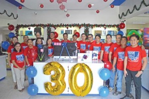 Saipan Computer Services staff poses with SCS business development director and KZMI afternoon radio personality Bobby Bogart yesterday after the raffle draw of the lucky winners. (Erwin Encinares)
