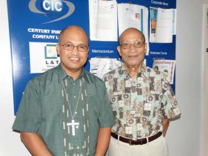David M. Sablan Sr., more affectionately known as Uncle Dave, poses with Bishop Ryan Jimenez on the former’s last day of work at the JP Center in Garapan. (Michael T. Santos)