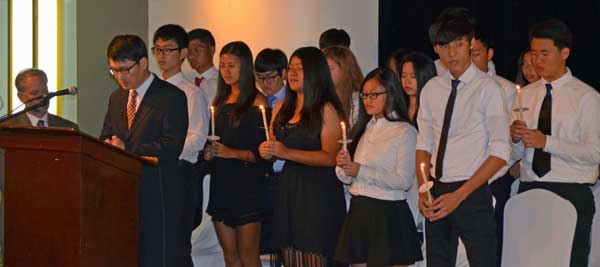 New National Honor Society members hold candles at the candle lighting ceremony. (Contributed Photo)