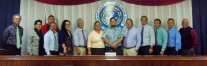 Frank Lee San Nicolas Borja, eighth left, joins Senate members along with his family and friends for a group photo after being confirmed as the Tinian representative on the Commonwealth Development Authority board in yesterday's Senate session at the Senate chamber on Capitol Hill. (Jon Perez)