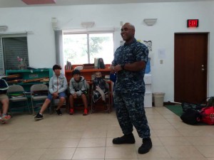 Petty officer Jacob Perrine gives a presentation to 5th graders at Seventh Day Adventist School on Monday, Feb. 13, 2017. (Demalynn S. Pagarao)