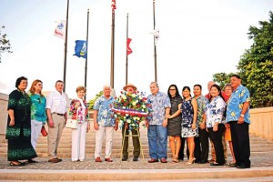 The visiting congressional delegation led by chair Rep. Rob Bishop of Utah, fourth from left, joins Gov. Ralph DLG Torres, fifth from right, in a wreath laying ceremony at the Court of Honor of the American Memorial Park. (Jon Perez) 