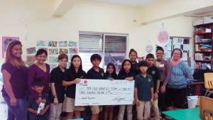 First lady Diann Torres donates $300 to the Saipan SDA School Lego Robotics Team on Wednesday, Feb. 15, 201. (Contributed Photo)