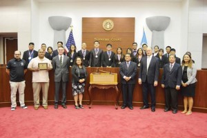 The Mount Carmel School team poses for a picture after receiving the first place plaque during Friday’s CNMI mock trial competition at the CNMI Supreme Court. In front row, from left, are MCS president Galvin Deleon Guerrero, Joe Taijeron, Charles Brasington, Public School System Associate Commissioner Lynette Villagomez, Chief Justice Alexandro Castro, Justice John Manglona, and Justice Perry Inos. (Erwin Encinares)