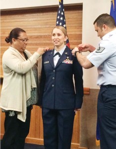 U.S. Air Force 1st Lt. Sidonia Williamson's rank is pinned on by her mother, Margaret Reyes, and her husband, U.S. Air Force Technical Sgt. Warren Williamson. (Contributed Photo)