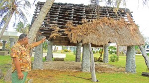Carolinian Affairs executive assistant John Henry Tagabuel points to the fire damage on the biggest of the traditional huts located at the Carolinian utt compound in Garapan yesterday morning.  Unidentified person or persons set the hut on fire last Tuesday night. (Ferdie de la Torre)