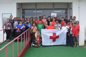 Acting governor Victor B. Hocog, fourth from right, joins American Red Cross NMI Chapter executive director John Hirsch and other members and volunteers for a group photo after signing the proclamation declaring March as ARC Month. (Contributed Photo)