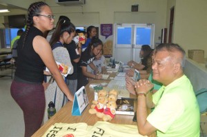 TanHoldings executives and employees entertain applicants from Dr. Rita H. Inos Junior and Senior High School during a job fair held last Friday at the Chamorro Bucks’ Auditorium. (Contributed Photo)