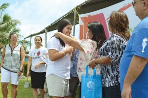 STEM Fair 9th to 12th grade cluster first place winner, Kagman High School senior Kloe Borja, receives her medal from Education Commissioner Cynthia Deleon Guerrero last Saturday during the STEM Fair awarding ceremony at Saipan Southern High School. (Erwin Encinares)