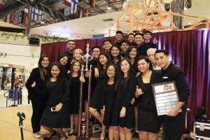 Marianas High School Glee Club Rhythm N’ Harmony musical director Paul Dujua, rightmost, poses with the group, the Perpetual Trophy, and the Perpetual Plaque after the group was awarded as the Overall Sweepstakes Winner in the Tumon Bay Music Festival over the weekend. (Contributed Photo) 