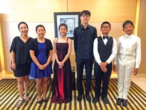 The five students of Yonsei Academy is joined by instructor Mrs. Yun after taking part in Guam’s Tumon Bay Music Festival. (Contributed Photo)