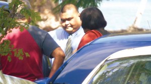 Corrections Officer Ray Anthony Maratita Camacho talks with his aunt, vice speaker Janet Maratita (R-Saipan), and a relative in the parking lot of the CNMI Judiciary complex in Susupe shortly after Superior Court Associate Judge Kenneth L. Govendo rendered his verdict finding Camacho guilty as to the charge of assault and battery for beating an inmate at the Department of Corrections. (Ferdie de la Torre)