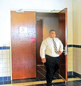 Corrections Officer Ray Anthony M. Camacho walks outside the courtroom during a break Wednesday at his ongoing bench trial in the Superior Court. Camacho is on trial on charges that he beat up then-inmate Ryan Cavalear at the Department of Corrections on April 1, 2016. (Ferdie de la Torre)