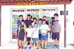 Sachiko Tahara, leftmost, back row, pose with Vivid Blue, a Japanese football team that has visited Saipan annually since 2007. (Erwin Encinares)