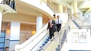 Former Department of Public Safety deputy commissioner Ambrosio T. Ogumoro walks behind his counsel, Mark B. Hanson, during a recess yesterday in Superior Court. Ogumoro and Herman M. Manglona (not in the photo) are on trial for corruption charges. (Ferdie de la Torre)