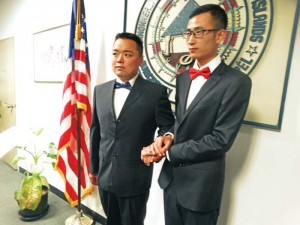 The Lyus stand before Saipan Mayor David M. Apatang last Thursday after being pronounced husband and spouse at the Saipan Mayor’s Office in Oleai. (Kimberly A. Bautista)