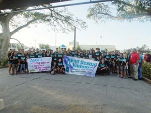 Participants of the Walk & Roll Against Sexual Violence pose for a group photo yesterday at the parking lot of the Chalan Kanoa Leadership Kiosku. (Kimberly A. Bautista)