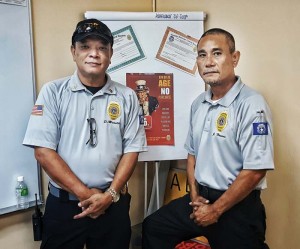 David R. Maratita, director of the Alcohol Beverage and Tobacco Control Division under the Department of Commerce, and John M. Hosono, ABTC enforcement officer, pose after the Public Service Recognition awards ceremony at the department. Both were recipients of awards or excellent performances and years of service.(BEA CABRERA)
