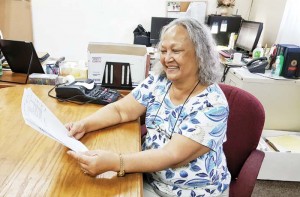 Julita Villagomez, executive director of the Commonwealth Election Commission, looks at the election schedule for next year.(Bea Cabrera)