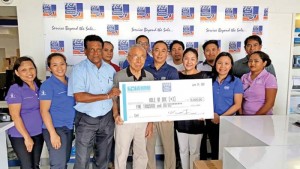 Computer Services director Jose Tiu, Business Development director Jerry Tiu, managing director Kazuko Kawabe, and TEAM Saipan Computer Services and Ideal Signs present a $5,000 hole-in-one check to HANMI Golf Tournament committee member Das Krishnan. The tournament will be held at Laolao Bay Golf & Resort west course on June 24, 2017. (CONTRIBUTED PHOTO)