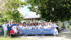 E-Land Group volunteers and students from Koblerville Elementary School pose for a photo during their cleanup at Coral Point Beach. (Contributed Photo)