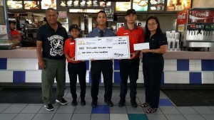 Ray Tebuteb, left, poses for a picture with McDonald’s Middle Road manager Joe Ayuyu Jr., center, and McDonald’s owner/operator Marcia Ayuyu, far right. (Contributed Photo)