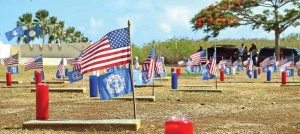 Small United States and CNMI flags line the graves of U.S. service members who were honored in yesterday's Memorial Day commemoration at the CNMI Veterans Cemetery in Marpi. (Jon Perez)