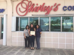 Shirley’s operations manager Noelle Macario is flanked by REACH program coordinator Becky Robles, right, and Public Health director Margaret Aldan, left, at the Shirley’s branch in Susupe. (Kimberly A. Bautista)