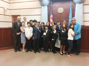 Saipan Community School students pose for a photo with their attorney coaches last Saturday at the non-competitive mock trial program held at the Guma Hustisia in Susupe. (Kimberly A. Bautista)