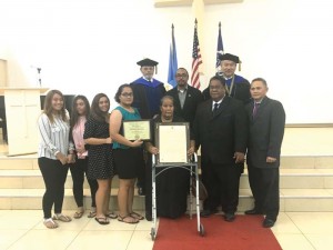The family of former Northern Islands mayor Jerome Aldan receives a plaque from the Saipan and Northern Islands Municipal Council and the Eucon University board. (Kimberly A. Bautista)