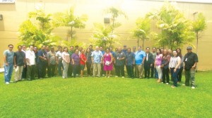 National Weather Service-Forecast Office Guam warning coordination meteorologist Charles “Chip” Guard poses with participants during the start yesterday of the two-day Annual NWS Tropical Cyclone, Disaster Preparedness, and Climate Workshop at the Emergency Operations Center on Capital Hill. (Ferdie de la Torre)