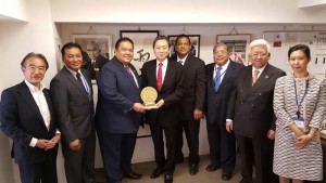 Tinian Mayor Joey P. San Nicolas and Sens. Jude U. Hofschneider, Francisco Q. Cruz, and Francisco M. Borja present a gift to former Japan prime minister Yukio Hatoyama. (Contributed Photo)